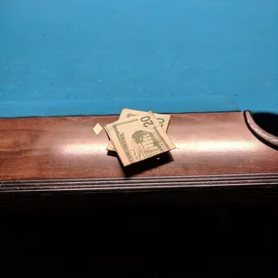 a billiard's hat on a billiard's table