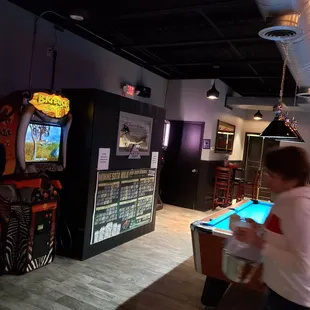 a woman playing a game of pool