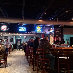 people sitting at the bar