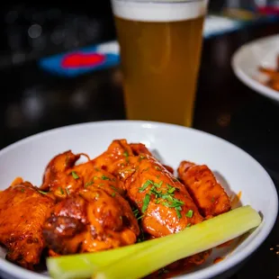 a plate of wings and celery