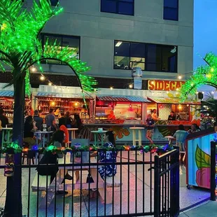 people eating outside at a restaurant