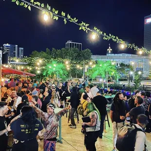 a crowd of people at a food truck event