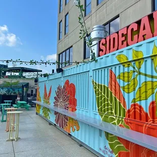 a colorful mural on the side of a building