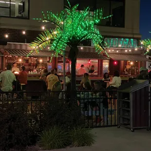a group of people sitting at a bar