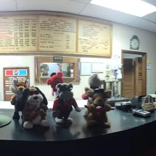 a man standing at a counter in a restaurant