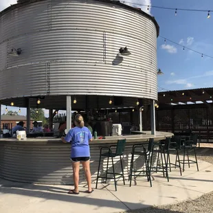 a woman standing in front of it