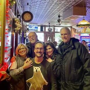 Happy customers with hospitable owner Eric