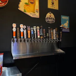 a row of beer taps