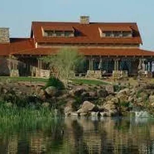 a view of the restaurant from across the lake