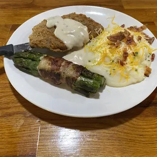 Chicken Fried Steak with loaded mashed potatoes and bacon-wrapped asparagus