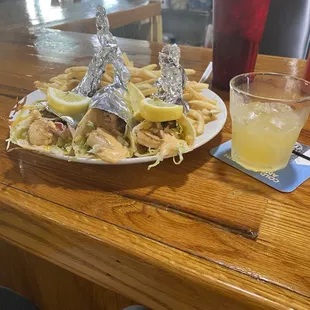 Shrimp Tacos with fresh pico de gallo and a spicy aioli with a side of fries and an amaretto sour