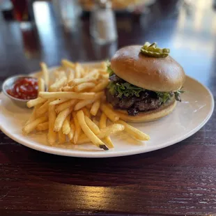a hamburger and fries on a plate