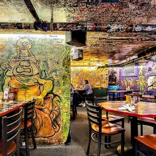 a restaurant with graffiti on the walls