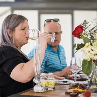 a man and a woman drinking wine