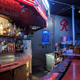 a bar with a neon sign