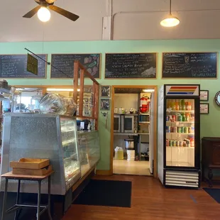 Front of house with menu boards, pie case, and cash register