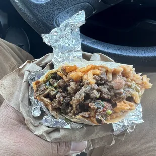 Carne asada regular burrito With a lot of good tasting meat.