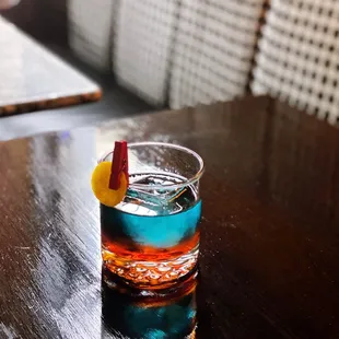 Patagonia Sunrise. TRÄ*KÁL, Aperol, Carpano Bitter, Combier Le Bleu Liqueur, Maurin Vermouth Blanc.