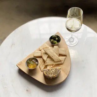 a plate of food and a glass of wine