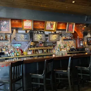 a row of bar stools at a bar