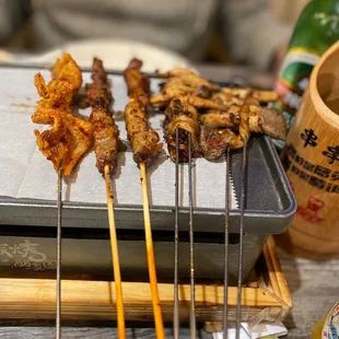 Chicken skin , beef , mushroom , ( they forgot to bring out our other chicken skin )