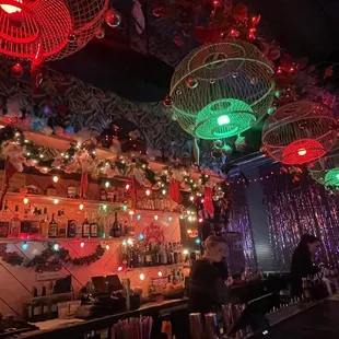 a bar decorated with christmas lights