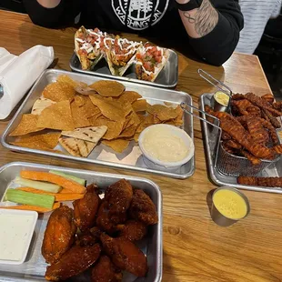 Mild &quot;Gameday&quot; wings, chicken fajita tacos, spicy crawfish dip, and sweet potato fries