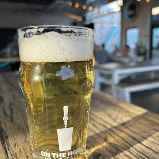 a glass of beer on a table