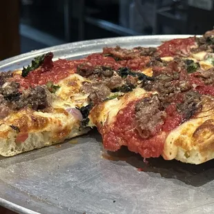 Surfin' Bird Pan - red sauce, mozzarella, chicken sausage, rapini, red onion, olive, and Calabrian chili soffritto.