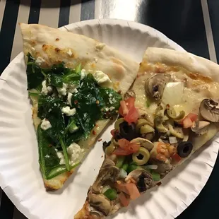 two slices of pizza on a paper plate