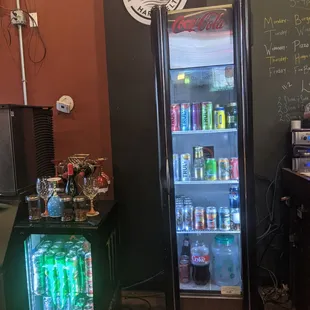 a refrigerator with drinks in it