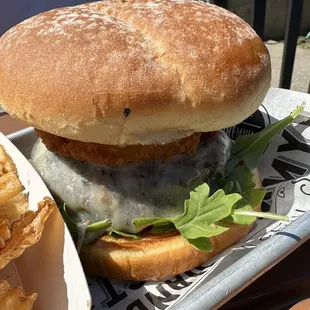 a burger and fries on a tray