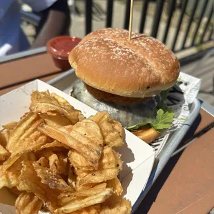 a hamburger and french fries on a tray