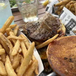 a burger and fries on a plate