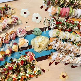 A surfboard a various sushi