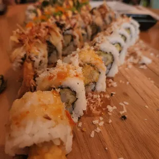 a sushi roll on a wooden board