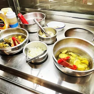 several bowls of food on the counter