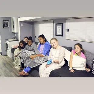 Our extra long couch is the perfect spot for 10 people to hang out.