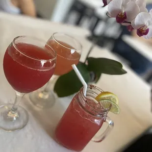 Cranberry and orange mimosa with watermelon sake lemonade