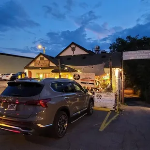 a car parked in front of a restaurant