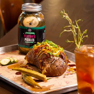 a baked potato and pickles