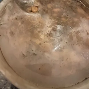 Hole in our baked beans that spilled all over the bag