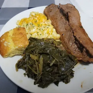 Brisket with mac and cheese, cornbread, and collard greens