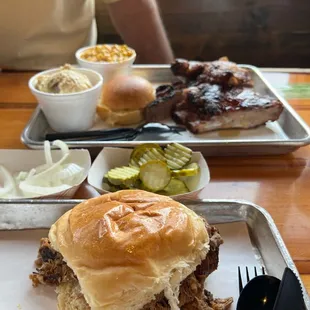 a pulled pork sandwich on a tray