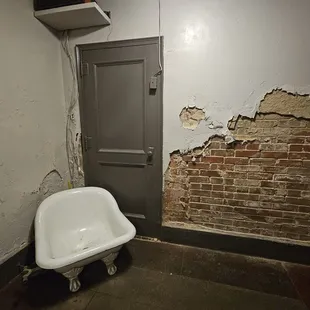 an old bathtub in a bathroom