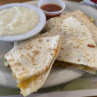 Breakfast quesadillas will bacon and grits plus salsa in the side.
