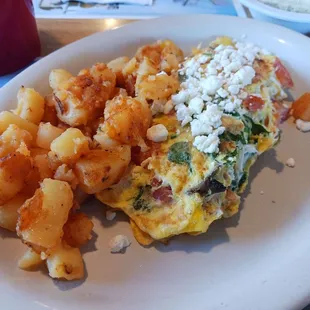 A very delicious Greek omelette and home fries.