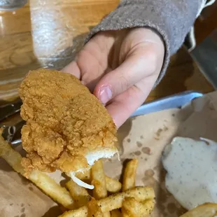 This is 1/3 left of a chicken strip from the kids meal. Comes with two. GOOD SIZES!