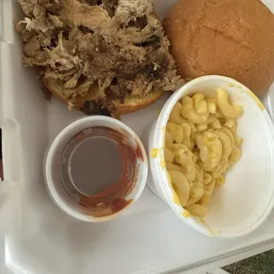 Pulled pork sandwich with side of Mac and cheese.