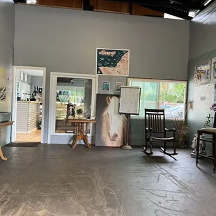 a living room with paintings